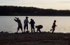 Kids playing at the lakeshore